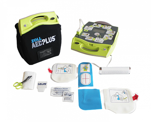 Défibrillateur automatisé externe (DAE) avec accessoires médicaux disposés autour.